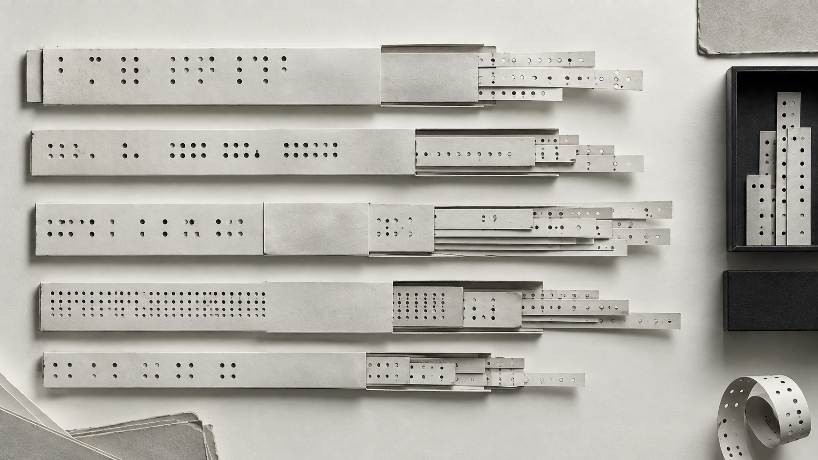 Layered paper records showing nested and repeating structures